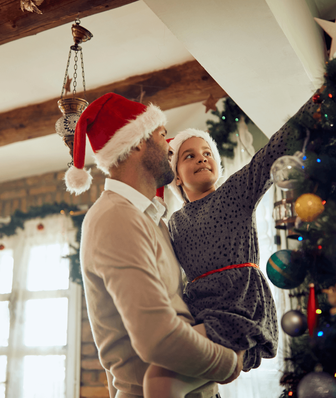 small kid decorating the christmas tree